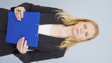 Vertical-video-of-Business-woman-closing-the-file-in-anger.